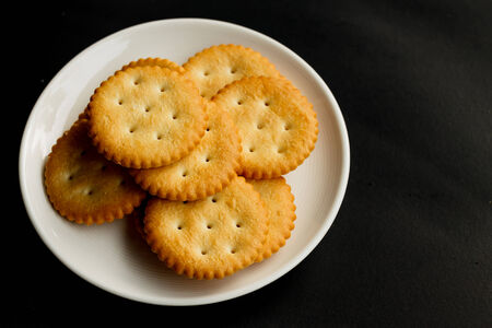 Crackers isolate on black backgroundの写真素材