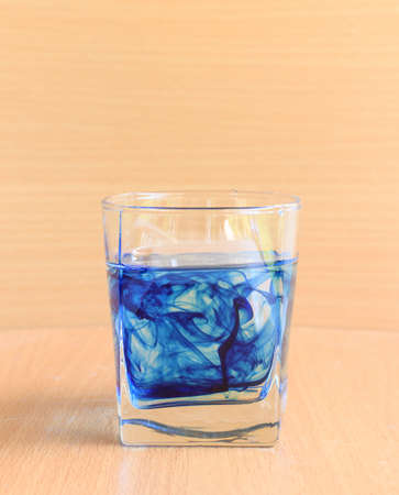glass of water with blue liquidの写真素材