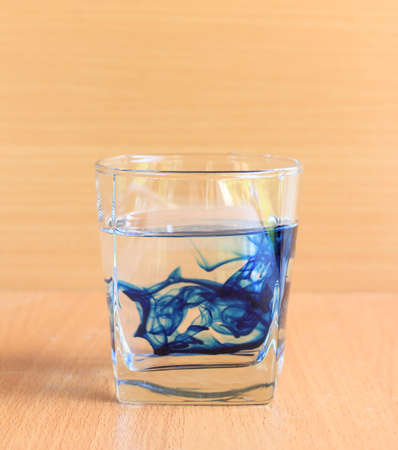 glass of water with blue liquidの写真素材
