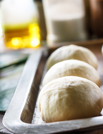 Small balls of fresh homemade pizza doughの写真素材