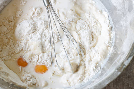 mixed yolk eggs, flour and sugar prepare for baking cake or bakeの写真素材