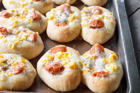 sweet bread with corn and sausagesの写真素材