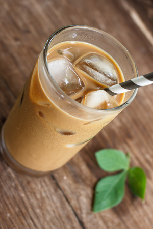 Glass Of Cold Coffee On Woodの写真素材