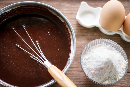 mixed yolk eggs, flour and sugar prepare for baking cake or bakeの写真素材