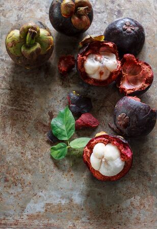 mangosteen put on grunge tray background popular fruit of Thailand.の写真素材