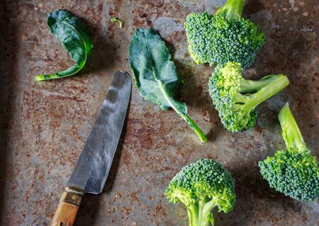 organic broccoli cut on grunge tray prepare for cook still life image dark tone