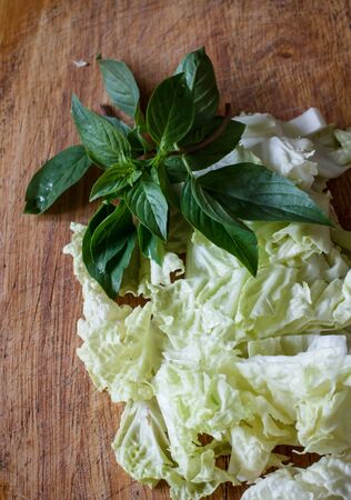 chinese lettuce still life image with thai basilの写真素材