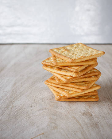 Cracker put on old woodの写真素材