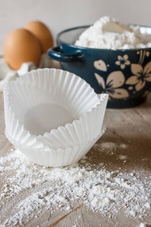 Flour for baking in green vintage bowl and organic eggsの写真素材