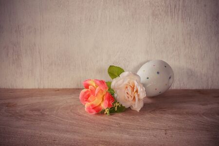 Vintage flower in a vase put on old wood backgroundの写真素材