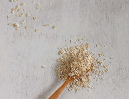 Oat in cup put on vintage white tableの写真素材