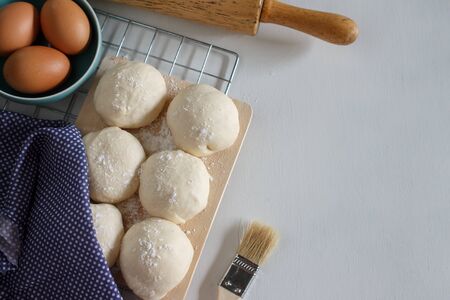 Yeast dough of homemade bread or pizza on wooden board