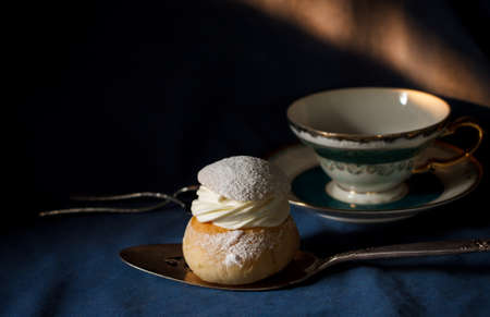 Semlor for Easter with blue cloth background, still life image dark toneの写真素材