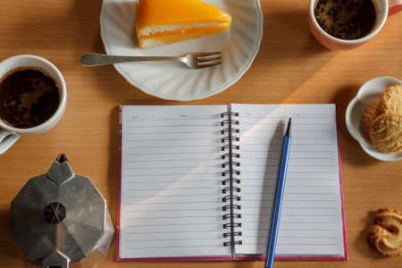 orange cake , butter cookies with espresso coffee in cafeteriaの写真素材