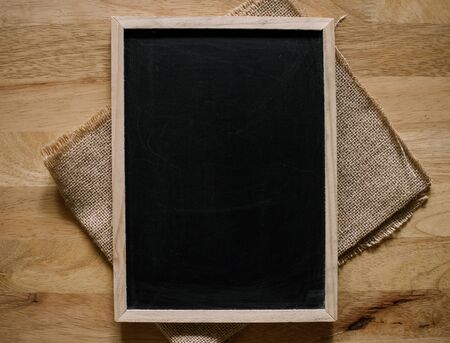 Wooden texture background, blackboard ( chalkboard ) texture. Empty blank black chalkboard with...