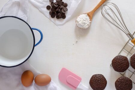 various of baking tool with chocolate muffin on white background.の写真素材
