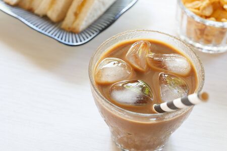 glass of cold iced coffee on tableの写真素材