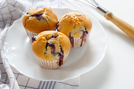 Homemade blueberry muffin in white plate.の写真素材