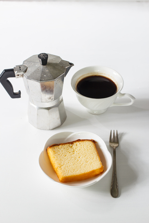 sliced of pound cake with black espresso coffee.の写真素材