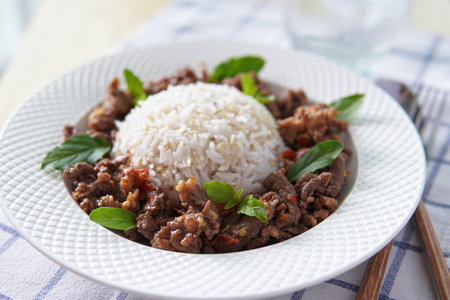 stir-fried beef spicy and basil served with brown rice.の写真素材