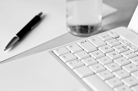 Set up of a conference room. Shallow depth of field. Focus around the area of the 'Q' key.の写真素材