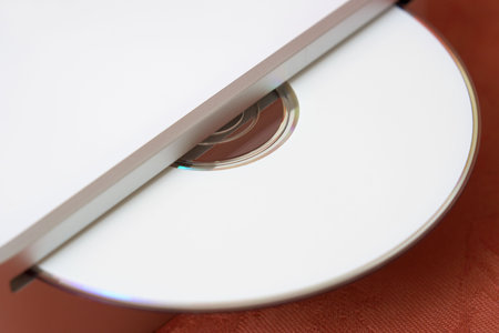 Close-up photo of an ejected CD for data backup or transferの写真素材
