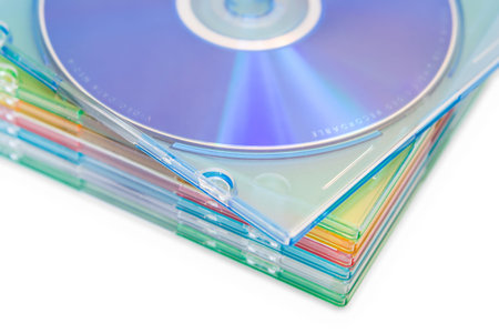 Data backup media: boxes of pastel coloured CDs or DVDs. Shallow depth of field with a slight high-key effect.の写真素材