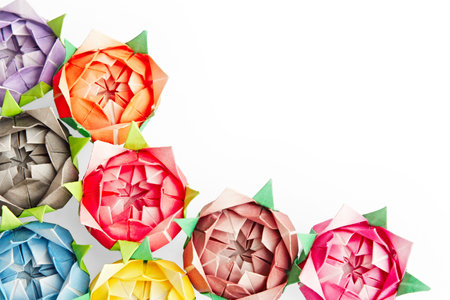Multicolour origami roses on a white background の写真素材