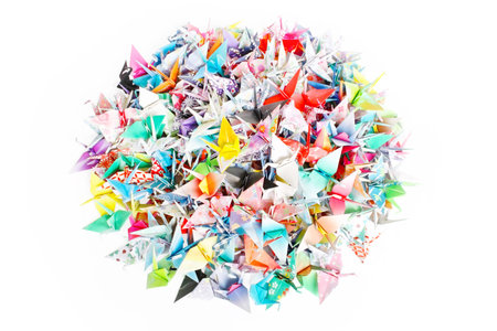 A circle pile of paper cranes isolated on a white background の写真素材