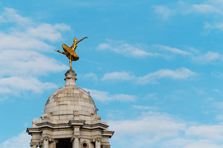 A gilded statue of ballerina Anna Pavlova above the cupola of the Victoria Palace Theatre, Londonの写真素材