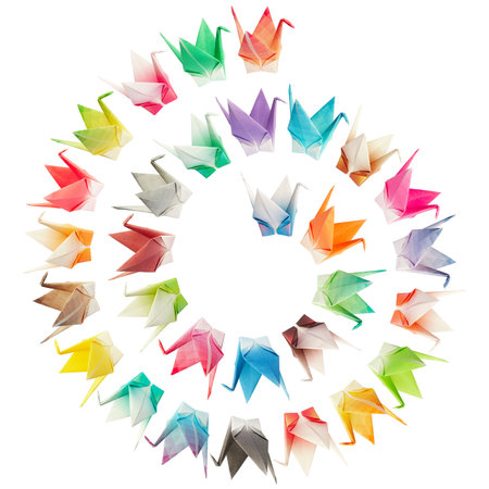Paper folded birds arranged in a spiral shape and isolated on a white background の写真素材