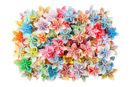 A rectangle pile of colourful paper flowers isolated on a white backgroundの写真素材