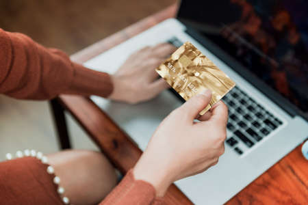 Picture of  Using the card over the Internet. Focus on the handの写真素材