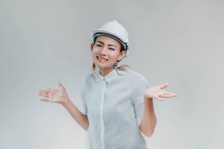 Asian women wearing a helmet and smiling happy emotions on a white background.Focus on faceの写真素材