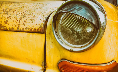 Headlight yellow vintage car. The morning light vintage.のeditorial素材