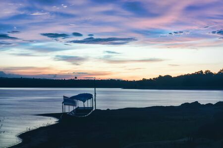 The atmosphere in the evening An old ship and fly to the flag of Thailand.の写真素材