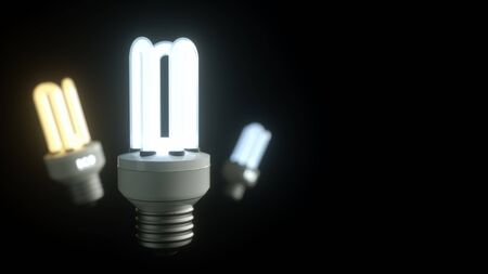 Energy saving lamp on a black background .