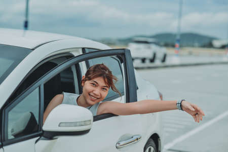 asian woman sitting passenger car on summer travel vacation. traveling concept. Relaxing and enjoyingの写真素材