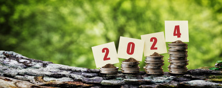 The paper is on a stack of coins and has the text 2024.. 3d, rendering, illustration, happy new year,の写真素材