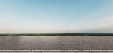 Realistic 3D rendering of an open road with a green horizon and soft blue sky. Ideal for travel and nature-inspired projects. 3D, rendering, illustration.の写真素材