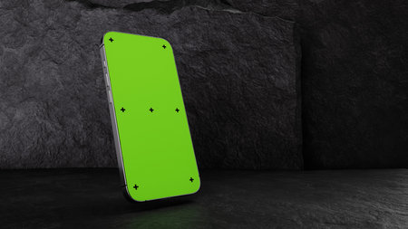 High-quality 3D rendering illustration of a smartphone mockup with a green screen, placed on a dark stone background for design presentations.の写真素材