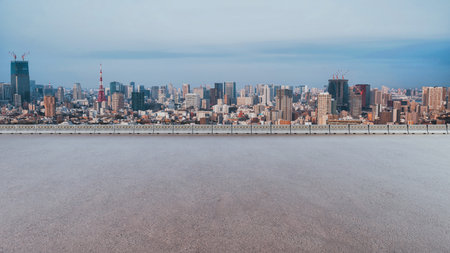Urban cityscape with empty road surface, blank asphalt background for automotive product placement, suitable for advertising tire, car, or transportation services.の写真素材