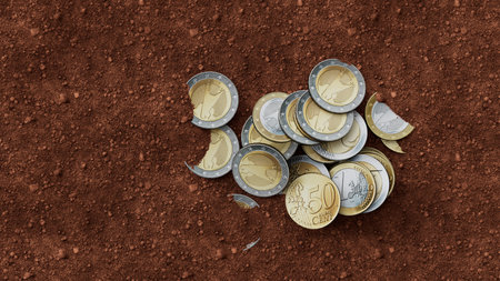 Vintage metallic coins on brown earthy soil surface still life retro composition concept of history and valueの写真素材