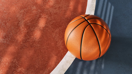 Classic orange basketball placed on textured court brown and blue surface outdoor sport minimal conceptの写真素材