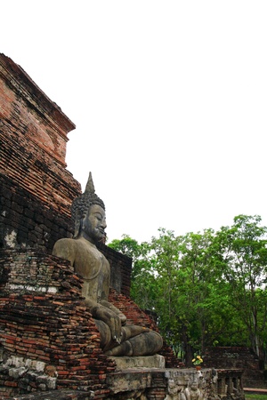 Buddha sit on ruins temple の写真素材
