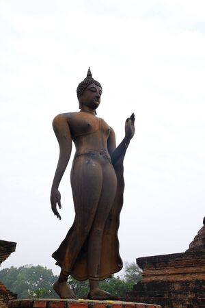Buddha stand in Sukhothai historical parkの写真素材