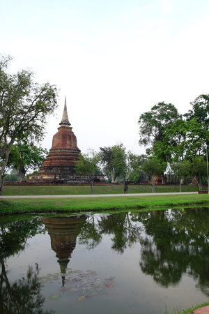 Stupa shadow on the waterの写真素材