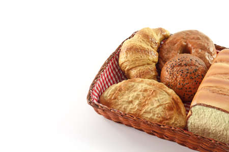 Bread in the basket on white isolated background.の写真素材