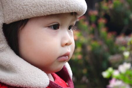 Cute face of baby in outdoor.の写真素材