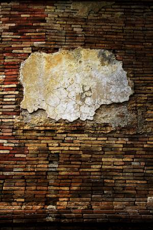 Old grunge brick wall with frame for text or picture.の写真素材